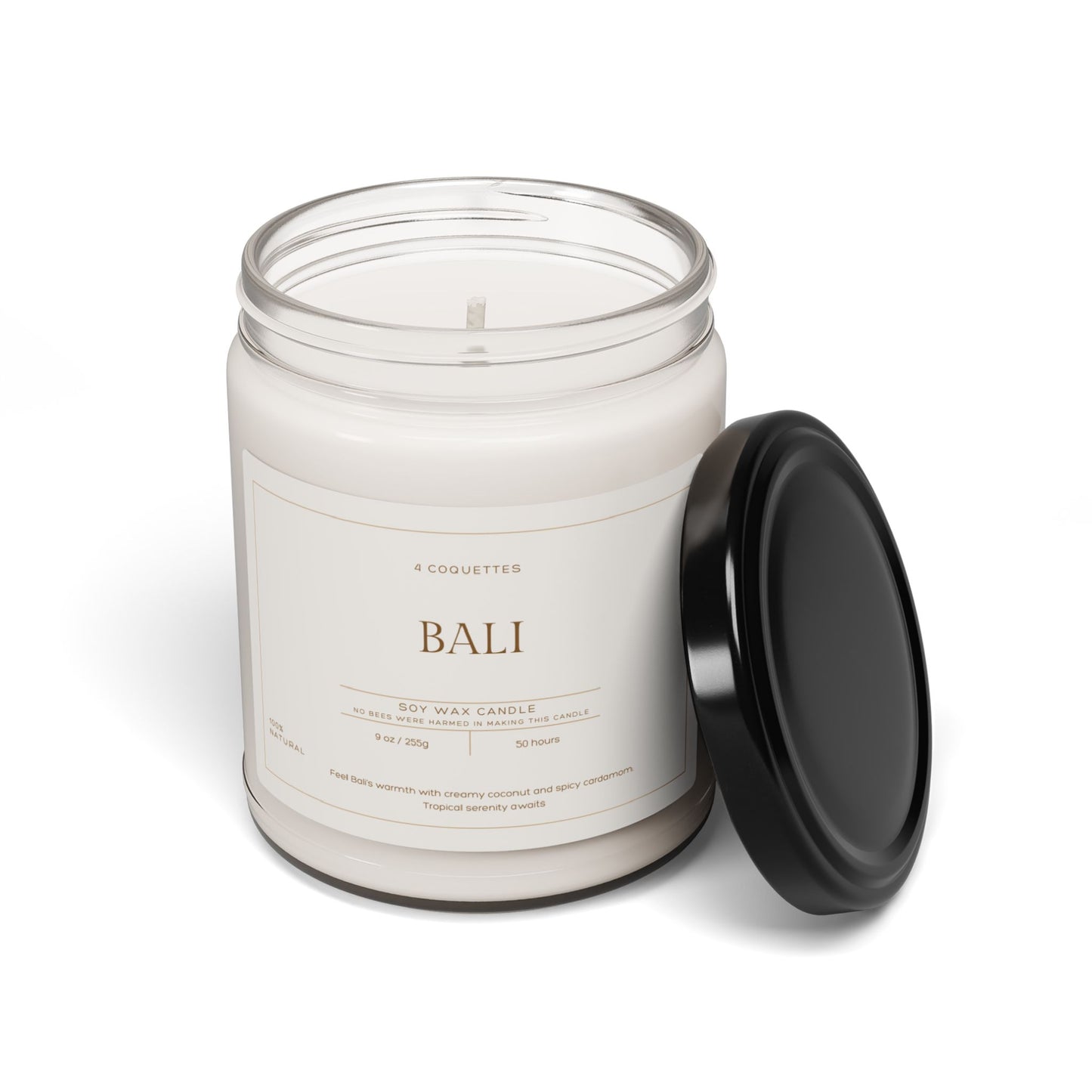 An eco-friendly vegan candle in a clear glass jar with a black lid, labeled Bali. Featuring coconut cream cardamom, zesty lemongrass, and tropical essential oils, this white candle captures the essence of the island. It sits elegantly against a plain white background. Perfect for Martin Luther King Jr. Day 2025